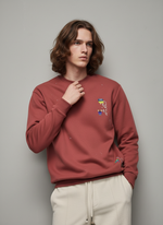 Man wearing a red sweatshirt with colorful graphic