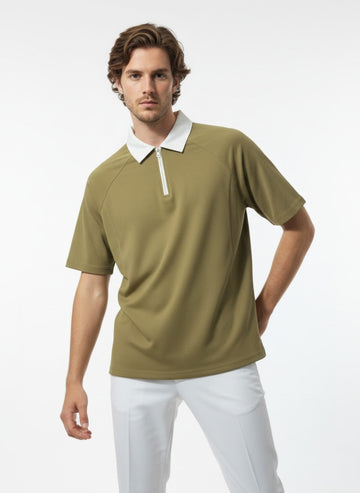 Man wearing a green polo shirt with a white collar on a white background