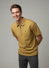 Man wearing a mustard yellow polo shirt 