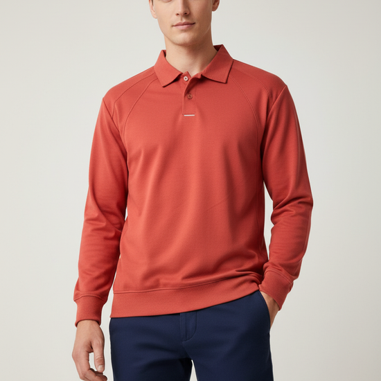 Man wearing a red long-sleeve polo shirt and blue pants on a light background